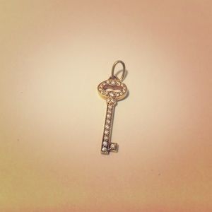 Tiffany&Co 
18kYellow Gold Diamond Key Pendant 18"
